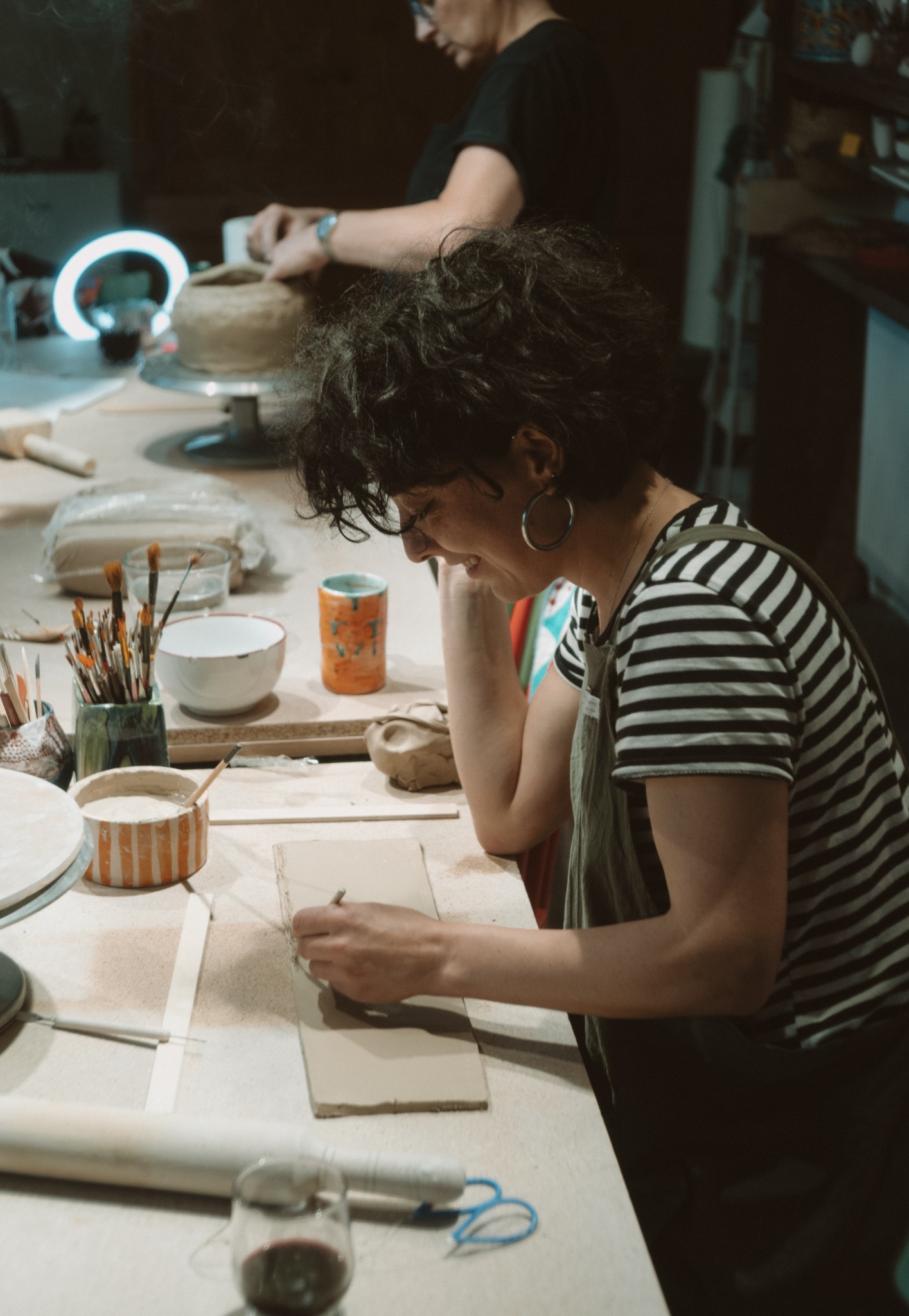 PotPot Studio craftsperson working at studio table