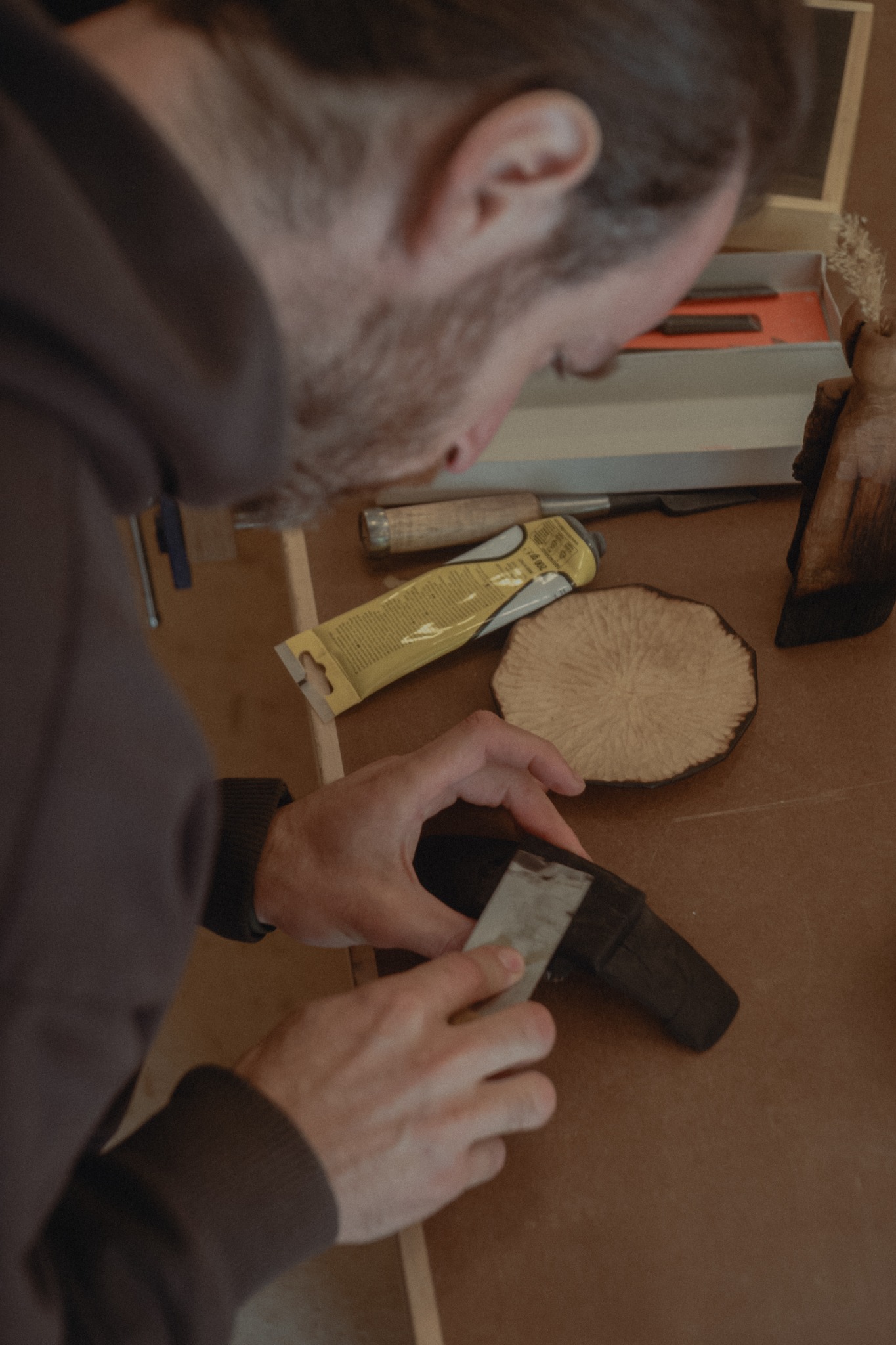 Kao Furniture: craftsperson shaving a wood form