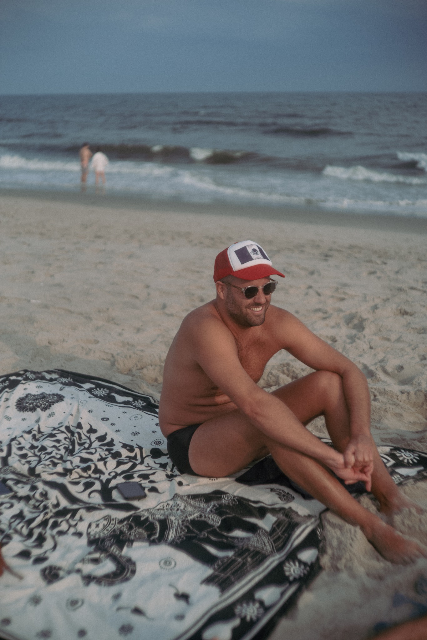 A man sitting quietly on the beach
