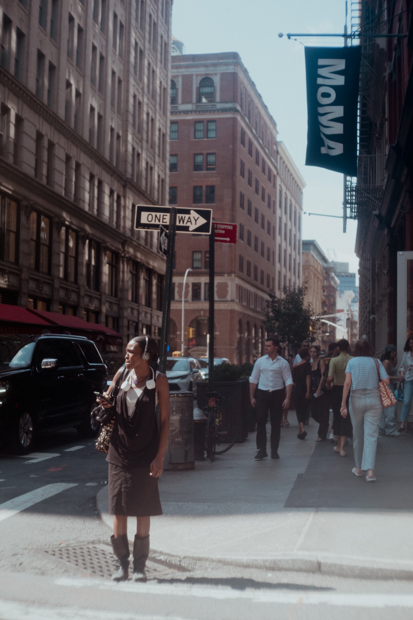 New York street photography downtown: pedestrians near MoMA